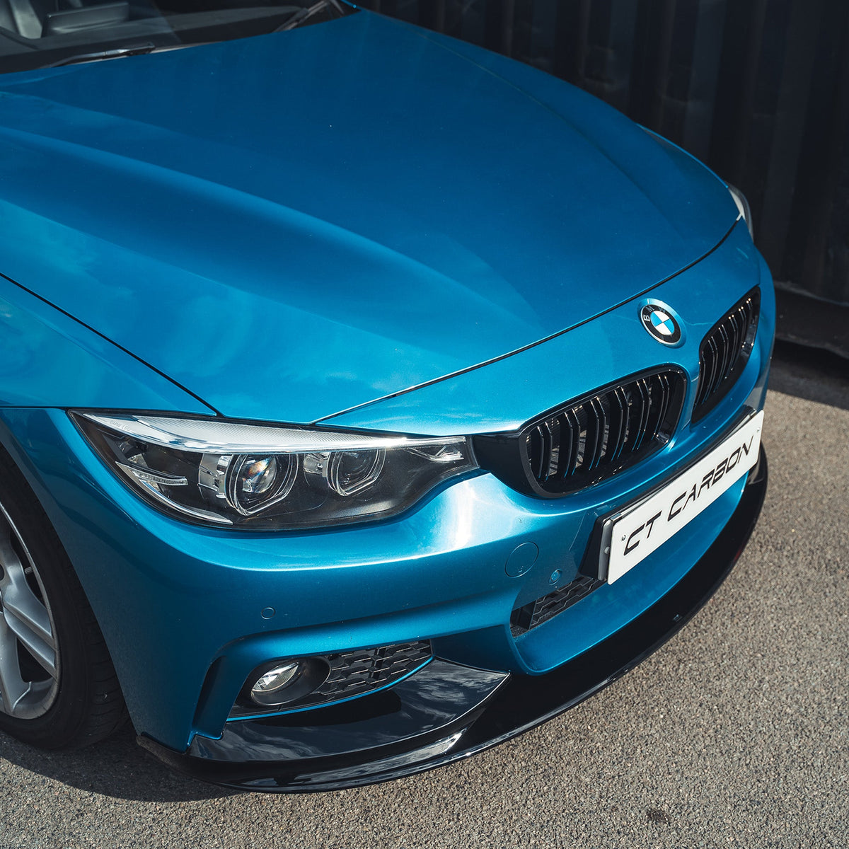 BMW 4 Series F32 2013-2020 gloss black full kit with twin exhaust, by CT Carbon, featuring sleek design and detailed components.