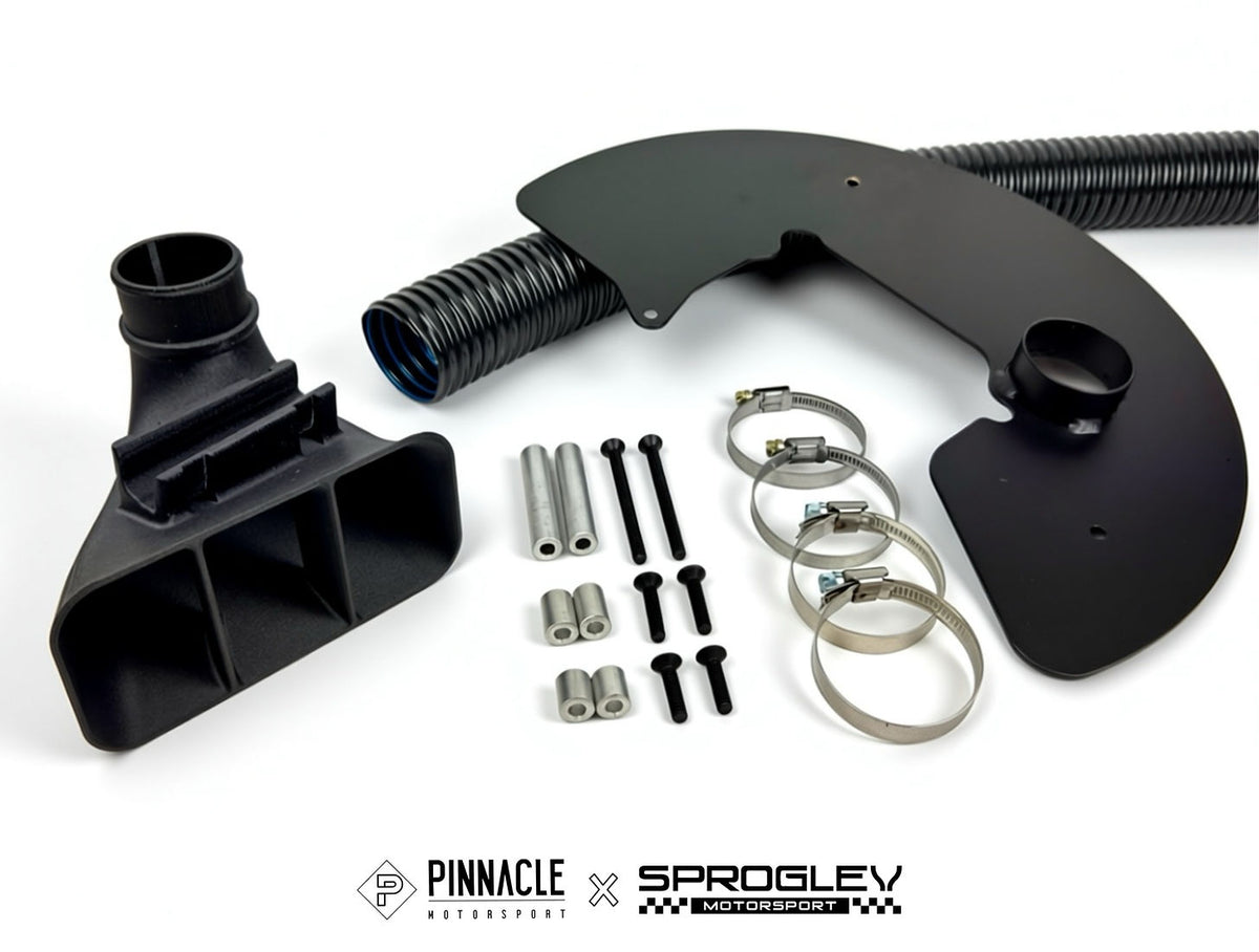 Sprogley Motorsport Pinnacle Complete Lower Arm Brake Cooling Kit with BMW F8X brake ducts showing metal and carbon fiber components
