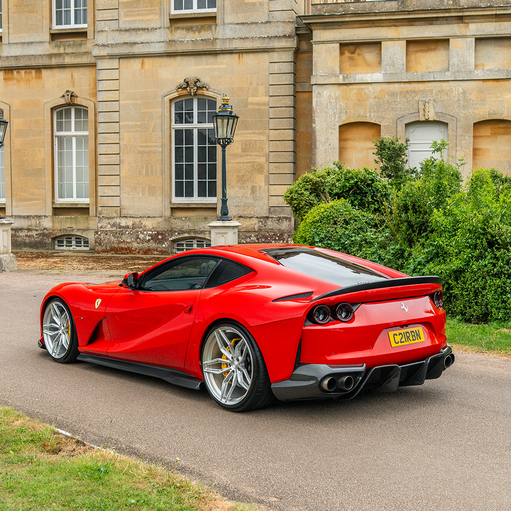 Ferrari 812 Superfast carbon fibre diffuser kit by CT Design, showcasing detailed carbon fibre components on the car.