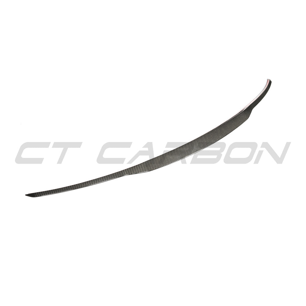 BMW X5/X5M F15/F85 2014-2018 carbon fiber middle spoiler by CT Carbon, showing sleek, aerodynamic design on vehicle.