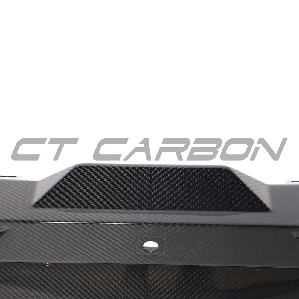 Lamborghini Revueltocarbon Fibre Rear Diffuser by CT Carbon showing sleek black carbon fiber design and aerodynamic contours.