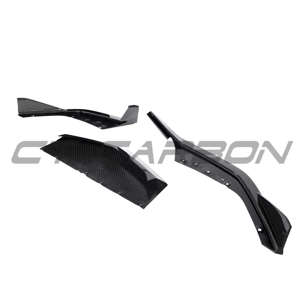 CT Carbon Lamborghini Revueltó carbon fiber front splitter, showcasing sleek design and aerodynamic features on a high-performance car.