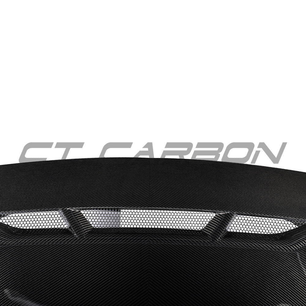 BMW F87 M2, M2 Competition, F20, F22 1 & 2 Series carbon fiber bonnet by CT Carbon, showing the sleek textured surface.