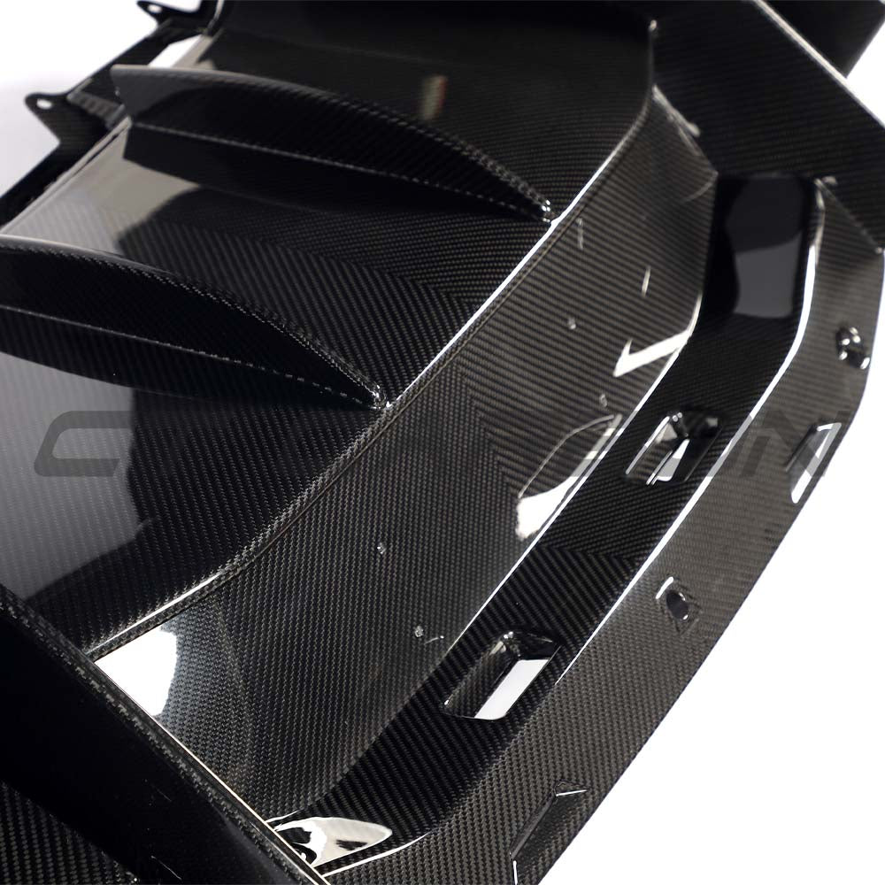 Lamborghini Revueltto carbon fibre rear diffuser by CT Carbon, showcasing sleek aerodynamic design and high-performance materials.
