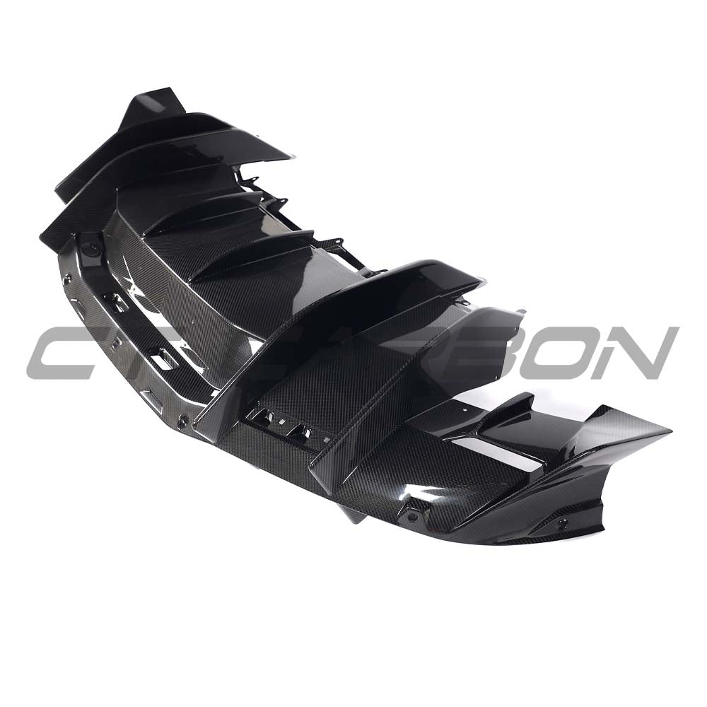 CT Carbon Lamborghini Revueltto carbon fibre rear diffuser showing sleek, aerodynamic design and textured carbon material.