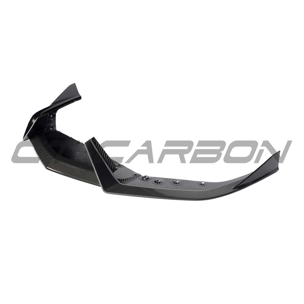 Lamborghini Revuelo carbon fibre front splitter by CT Carbon, showing sleek aerodynamic design and textured carbon fiber surface.