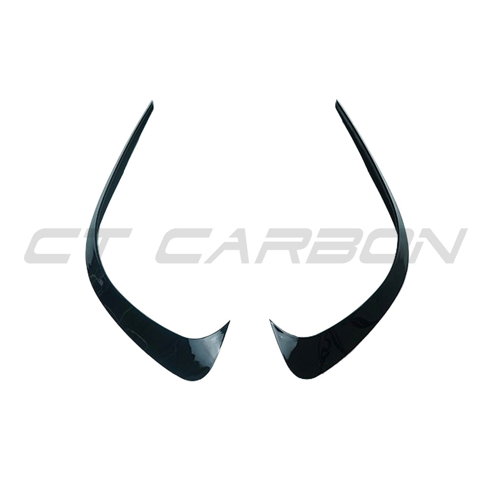 Mercedes W206 2021+ C-Class Gloss Black front bumper corner trim splitter by CT Carbon, showcasing sleek, aerodynamic design.