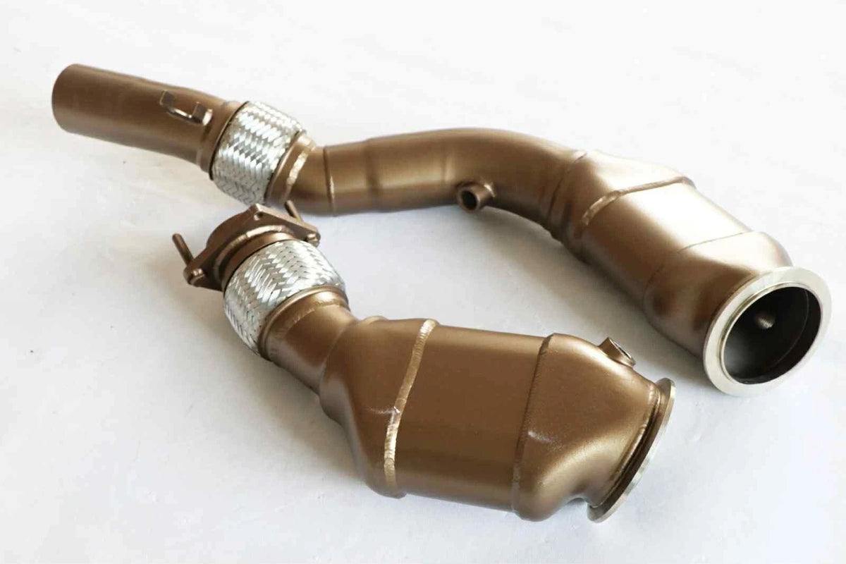 SLN Performance BMW S55 ceramic-coated sport cat downpipes for M2C F87 M3 F80 M4 F82 models, showing the polished metal pipes.