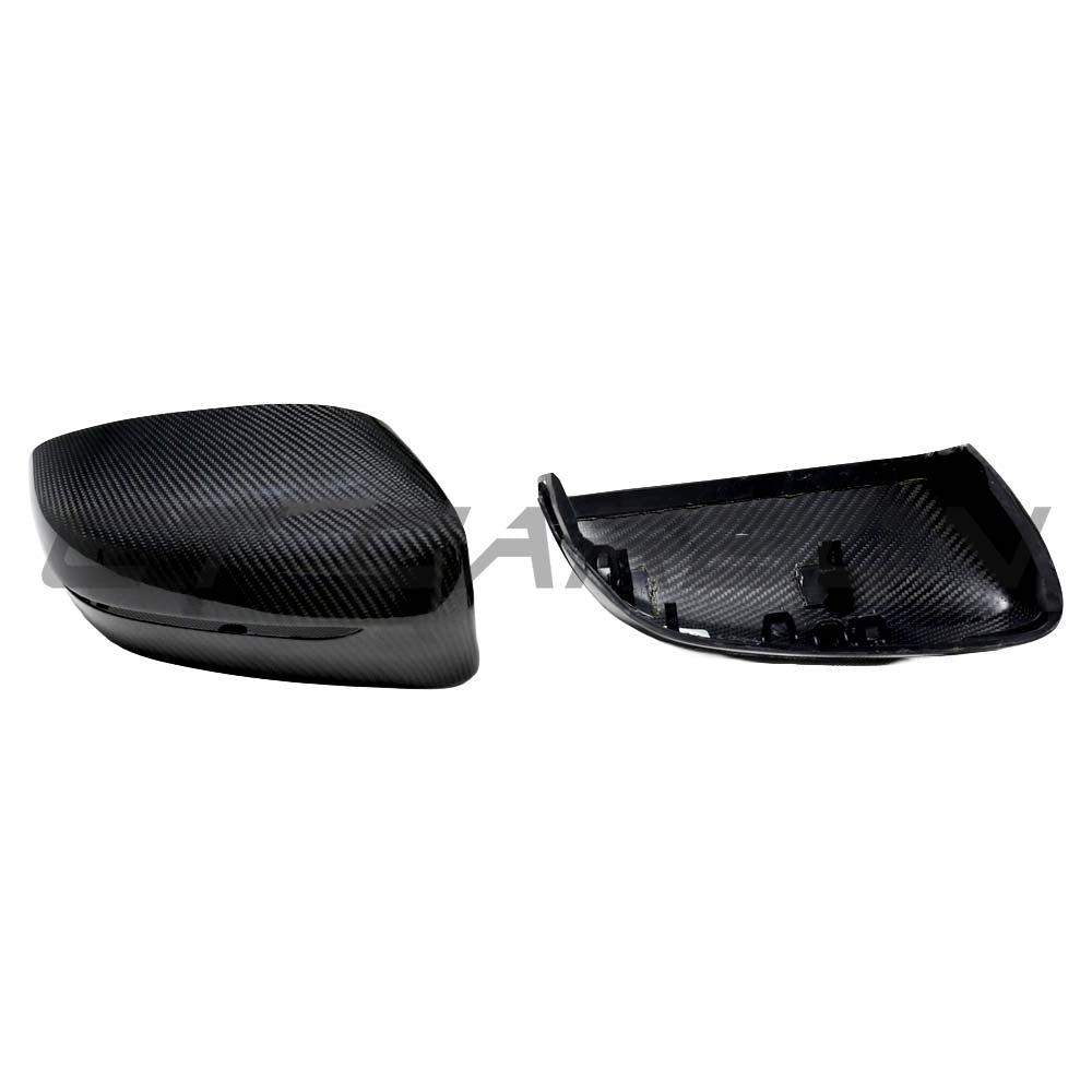 BMW G42 2 Series 2022+ LHD dry carbon fiber mirror cover replacements by CT Carbon, showing sleek mirror covers on the vehicle.