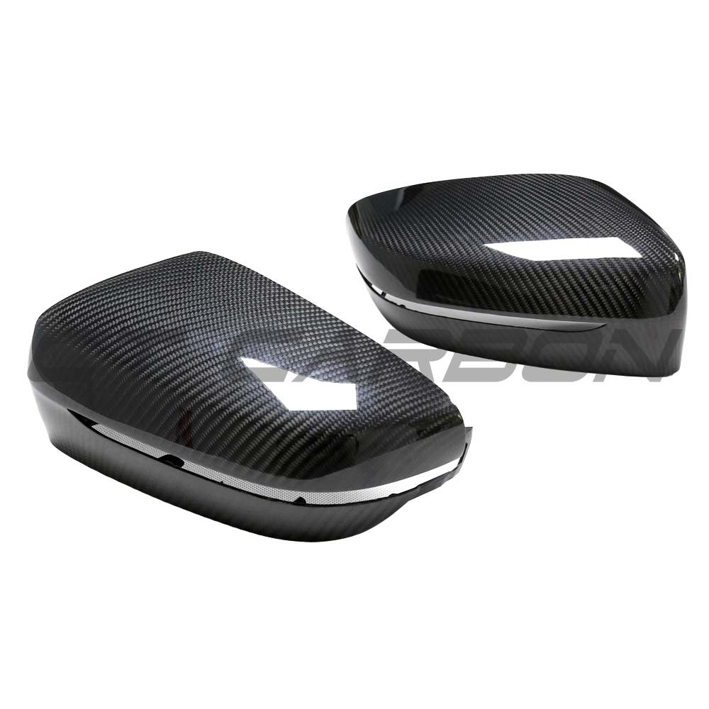 BMW G42 2 Series 2022+ dry carbon fiber mirror cover replacement by CT Carbon, showing sleek, textured carbon fiber surface.