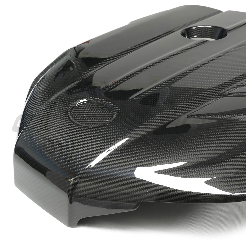 Carbon fiber engine cover for Toyota Supra A90 3.0T B58, accessory by CT Carbon, shown installed on the engine bay.