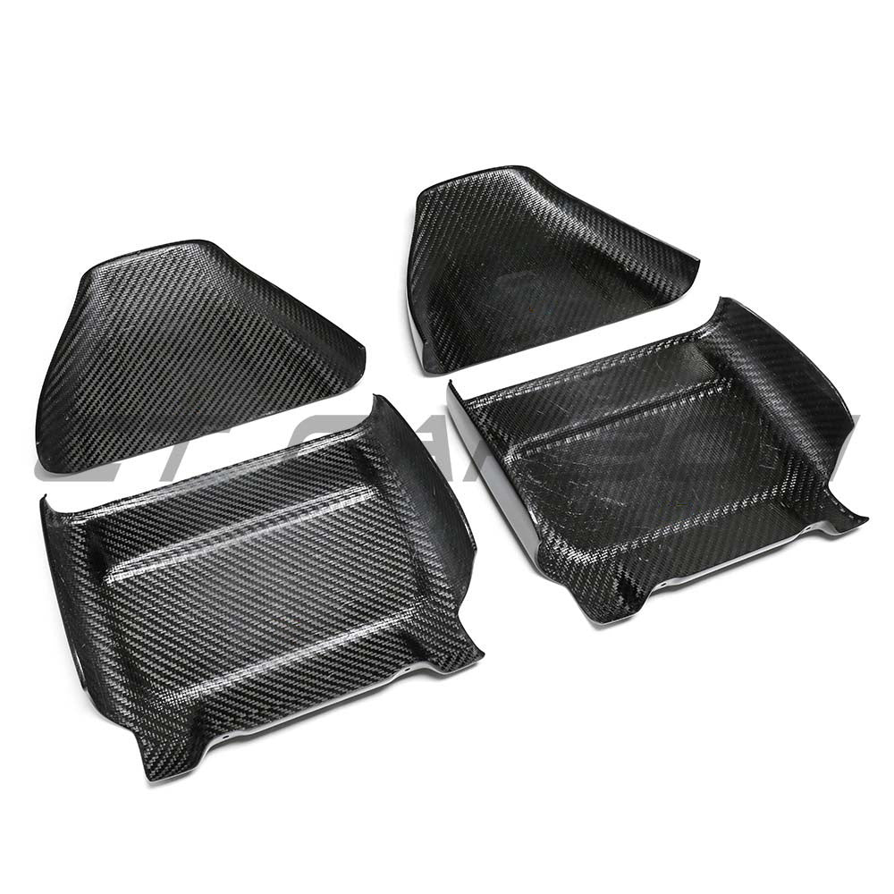BMW M5 F90 dry carbon seat backs from CT Carbon, showing sleek, lightweight carbon fiber interior accessories with a textured finish.