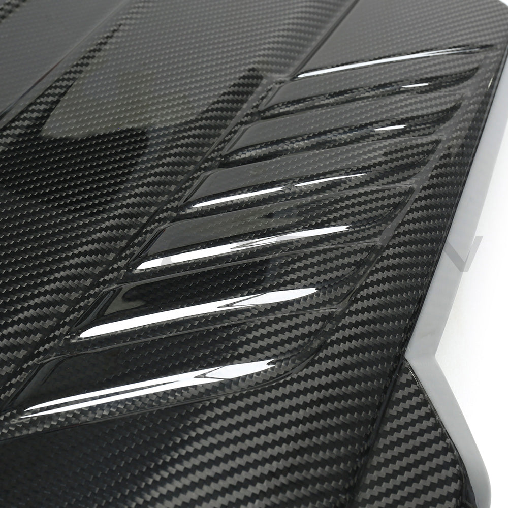 Carbon fiber engine cover for Toyota Supra A90 3.0T B58, designed by CT Carbon, showcasing sleek, textured material on the engine.