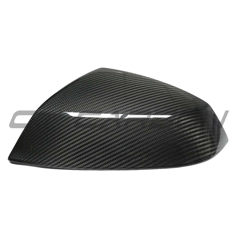 Audi Q5/Q7 2015+ dry carbon fiber mirror cover replacements by CT Carbon, shown on vehicle side mirror with a sleek finish.