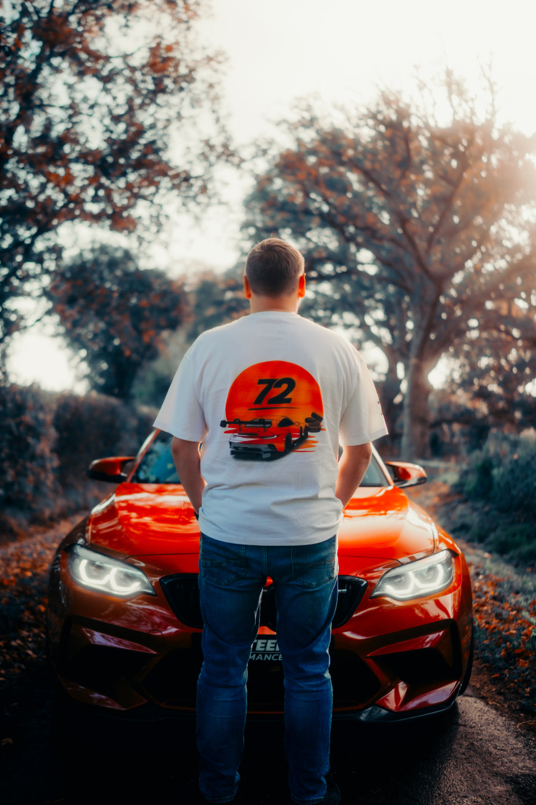 Nineteen72 Performance Flat Six Sunset T-Shirt featuring a vibrant sunset graphic on a casual cotton tee
