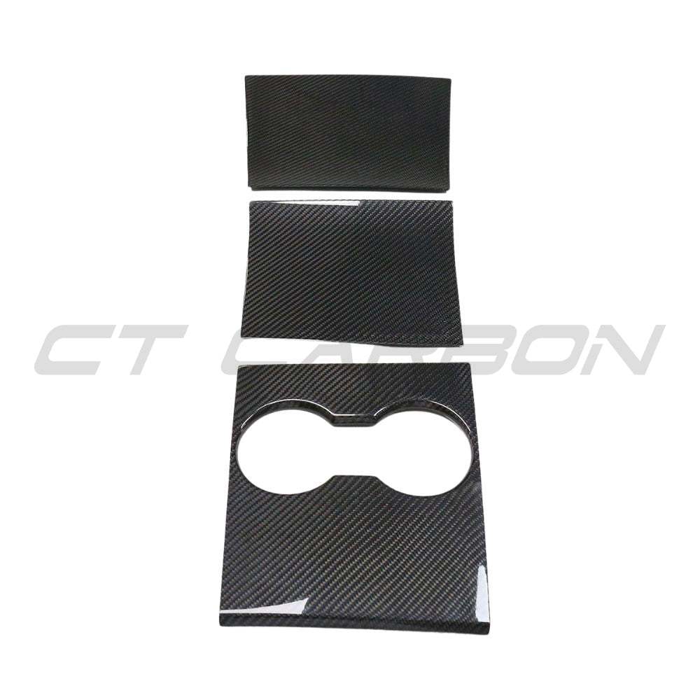 Carbon fiber centre console add-on for Tesla Model 3 (2017-2023) by CT Carbon, showcasing sleek, textured carbon fiber surface.