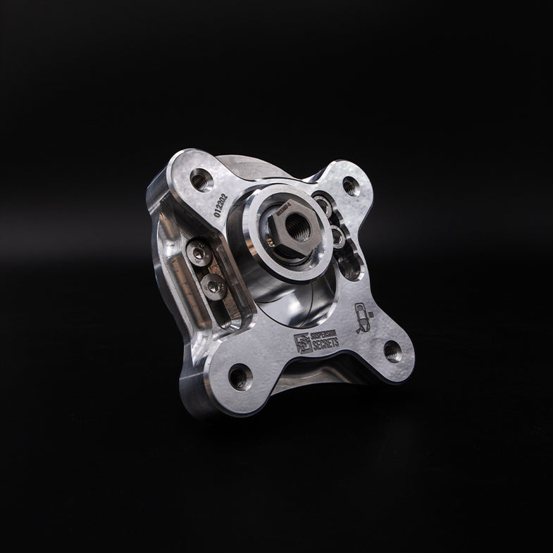 Suspension Secrets adjustable camber and caster plates for BMW G87 M2, showing the kinematics kit with metal plates and mounting hardware.