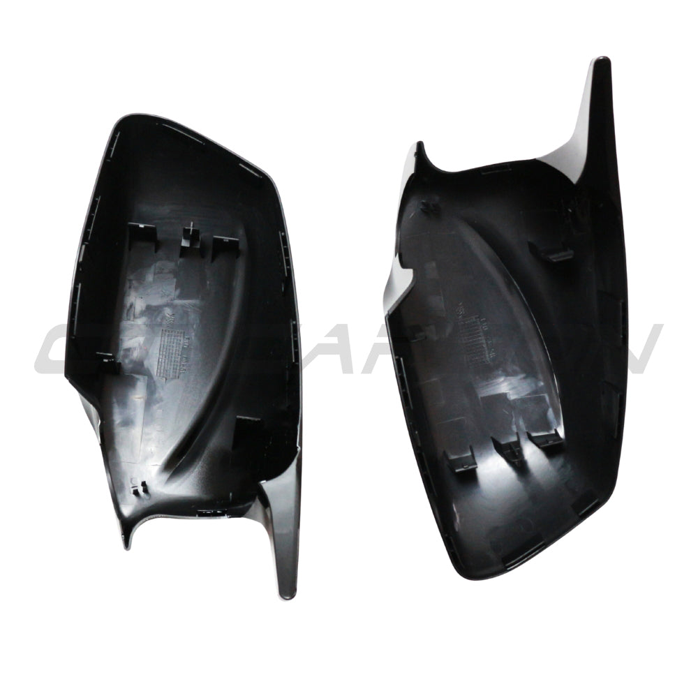 BMW 5 Series F10/F11 2011-2013 CT Carbon gloss black side mirrors with sleek finish and aerodynamic design.