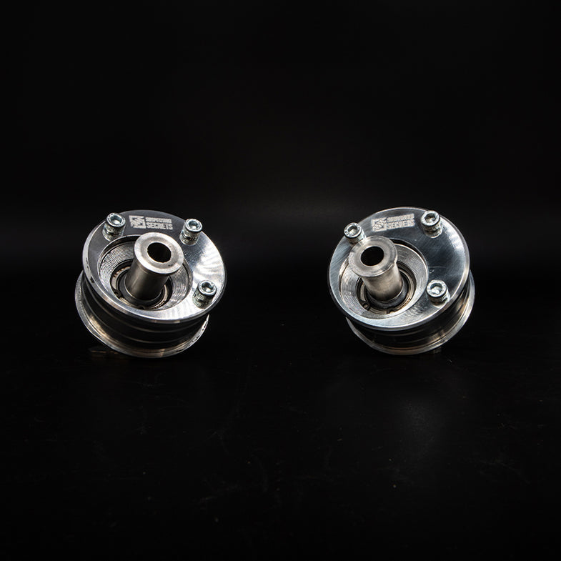 Suspension Secrets front offset caster bushes for BMW F80 M3 and F82 M4 suspension linkages, shown installed on vehicle.