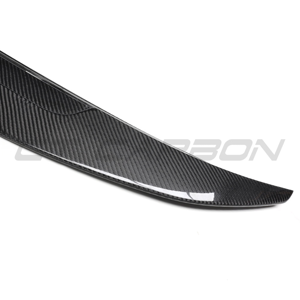 BMW 8 Series and M8 G16/F93 carbon fibre spoiler by CT Carbon, showing sleek aerodynamic design and textured carbon fiber surface.