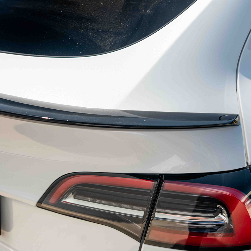 Full gloss black car body kit for Tesla Model Y MK1 2020-2025 by CT Carbon, shown installed on the vehicle.