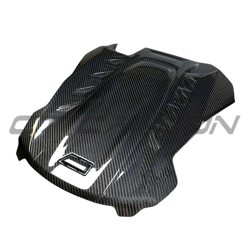 CT Carbon F95 X5M/F96 X6M dry carbon fiber engine cover accessory with sleek, textured carbon finish and precise fit details.