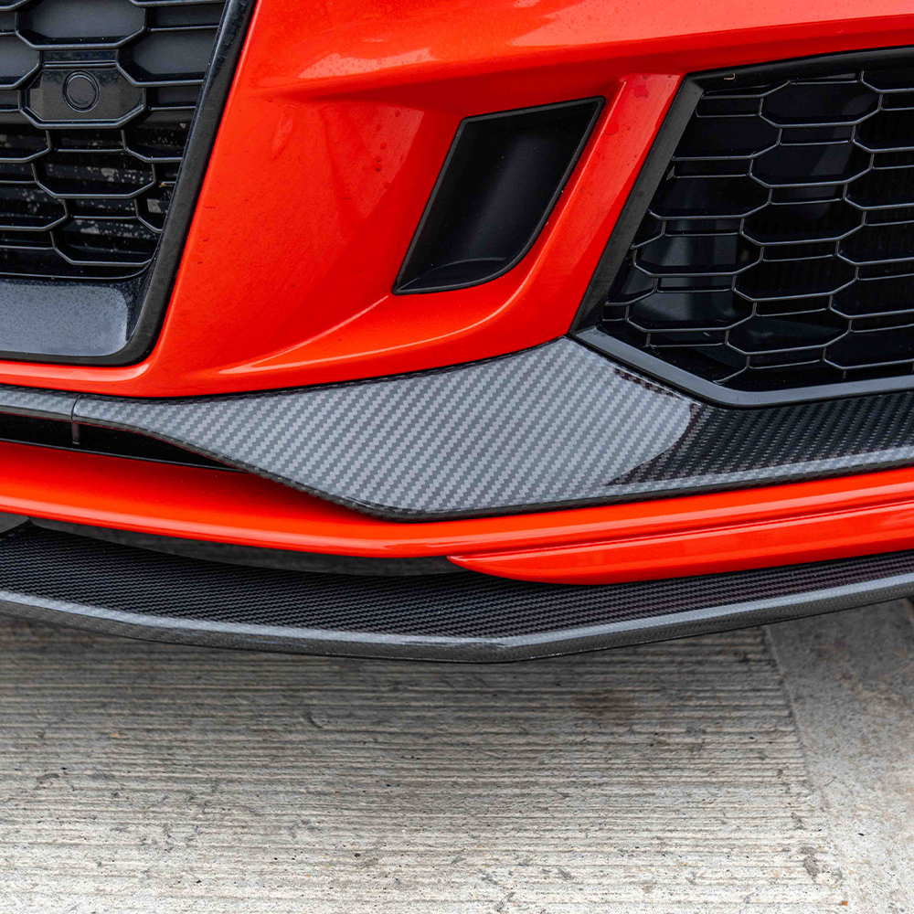 CT Carbon Audi RS3 8V saloon car carbon fibre splitter V1 installed on the front bumper, showcasing a sleek, lightweight aerodynamic design.