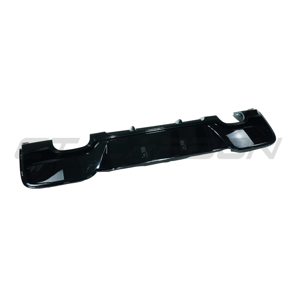 BMW 1 Series F20/F21 2012-2014 pre-LCI gloss black diffuser with quad tips by CT Carbon, shown on a car.