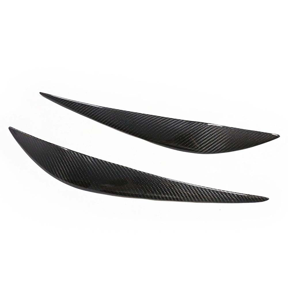 BMW F30 3 Series 2011-2018 dry carbon fiber eyelids by CT Carbon, close-up of sleek, aerodynamic car accessory on vehicle.