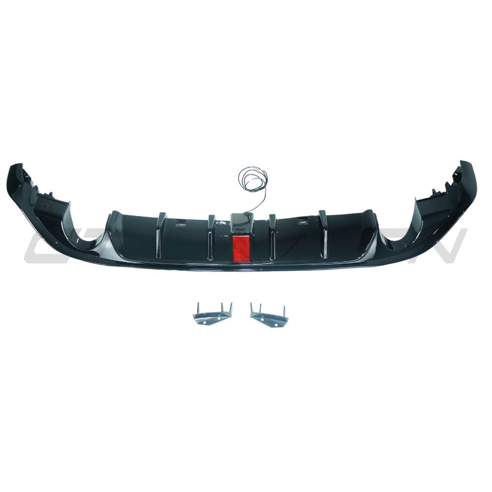 Gloss black diffuser with LED light for Volkswagen Golf GTI/GTD MK7/7.5 2017-2020, by CT Carbon, shown installed on car rear.