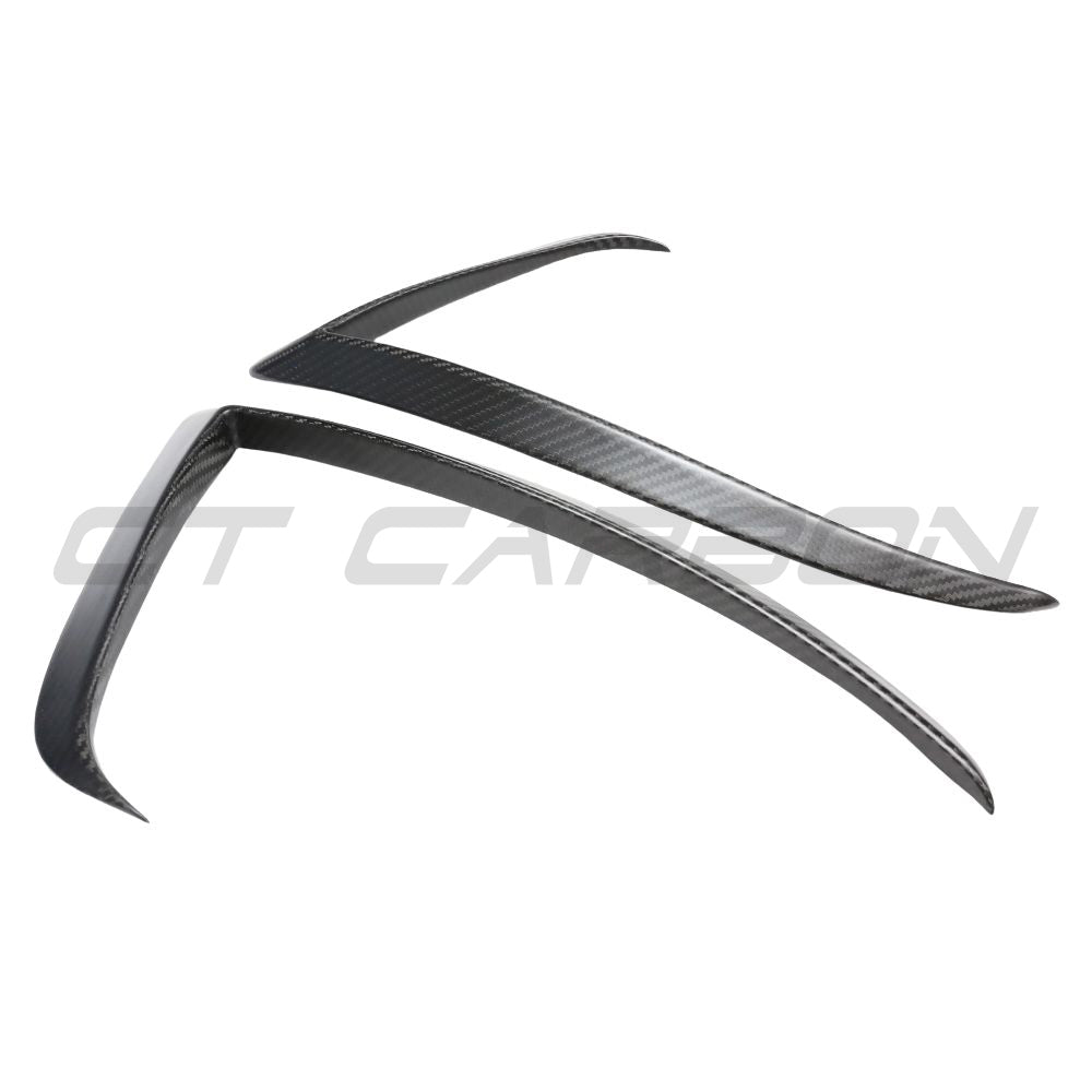 Close-up of CT Carbon carbon fiber front bumper canards for Tesla Model 3 2017-2023, showcasing sleek aerodynamic design.