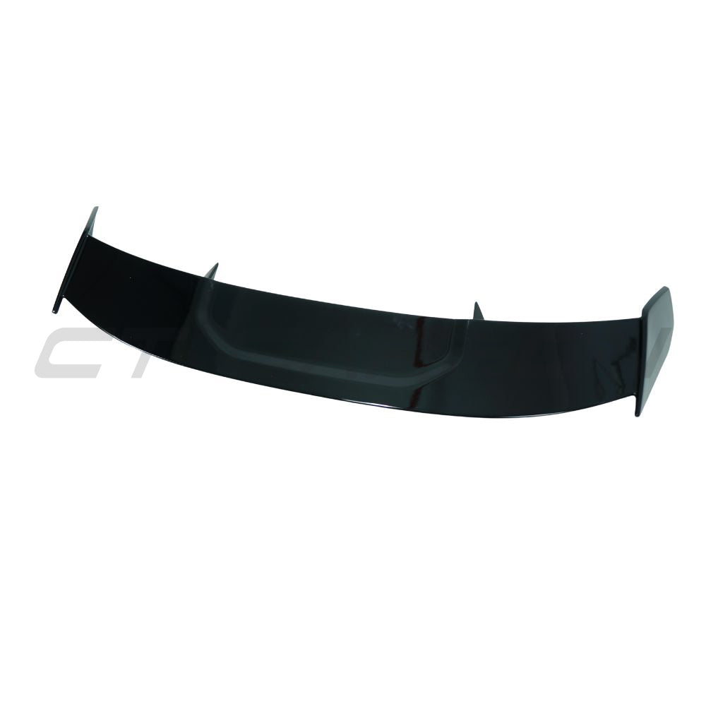 Gloss black carbon fiber spoiler for BMW F40 and F70 1 Series 2019+ by CT Carbon, showing the sleek aerodynamic design.