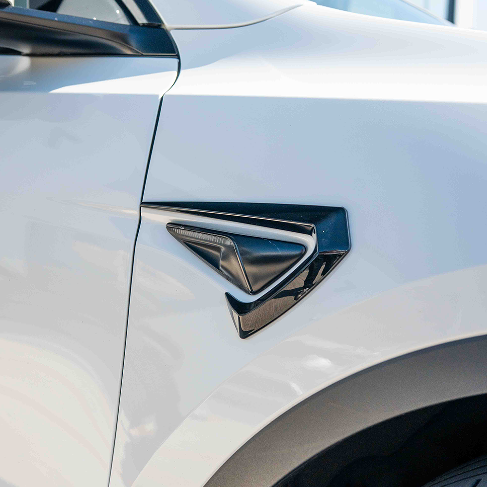 Full gloss black car kit for Tesla Model Y MK1 2020-2025 by CT Carbon, featuring sleek, high-quality exterior parts.