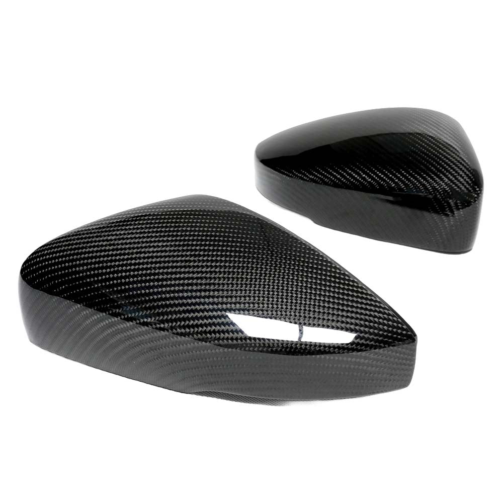 VW Polo MK5 2015-2018 CT Carbon dry carbon fiber mirror cover replacements on car side mirror, showcasing sleek, textured finish.