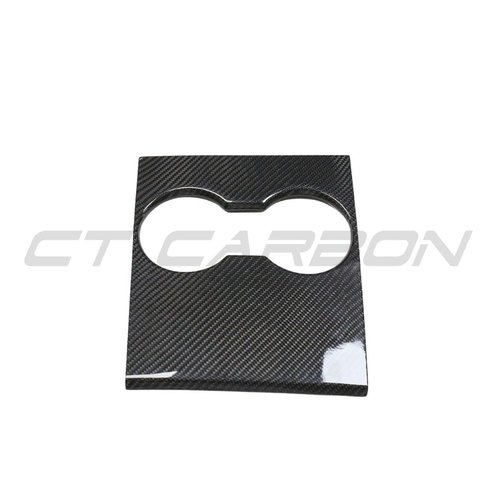Carbon fiber center console add-on for Tesla Model 3 (2017-2023) by CT Carbon, showing sleek textured finish and precise fit.