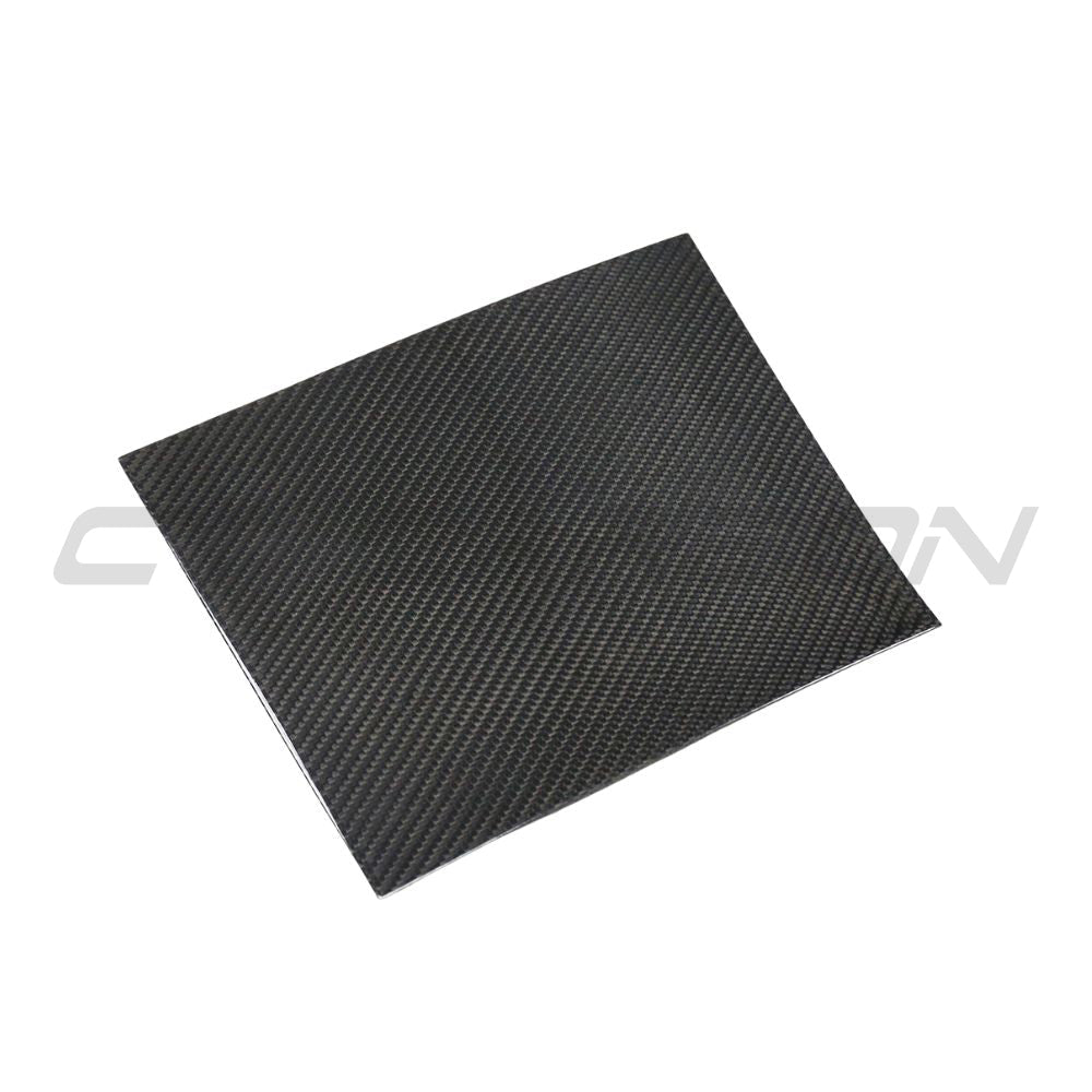 Carbon fiber center console add-on for Tesla Model 3 2017-2023 by CT Carbon, showing sleek, textured carbon fiber surface.
