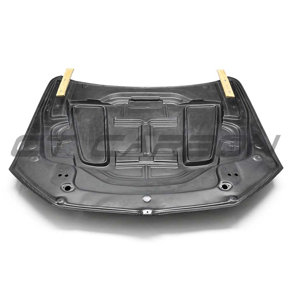 BMW F90 M5 and G30 5 Series dry carbon fiber bonnet by CT Carbon, showcasing sleek, lightweight automotive hood design.