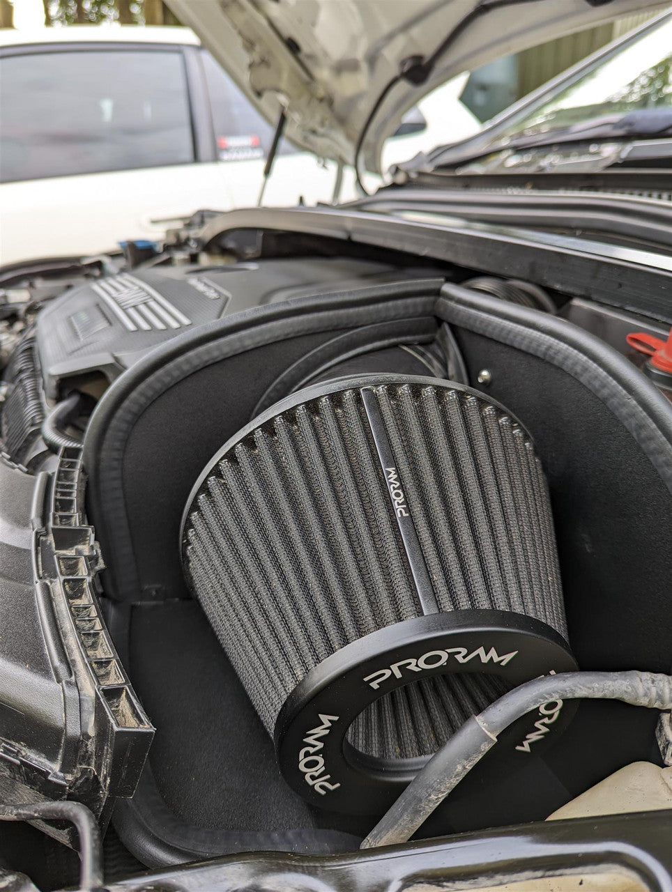 Ramair induction kit panel air filter installed in BMW 128ti, 135i, and Mini Cooper GP F56 engine bay, showcasing high-performance air filtration.