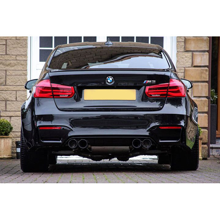 Cobra Sport BMW M3 F80 3-inch valved primary cat back performance exhaust system installed on a car.