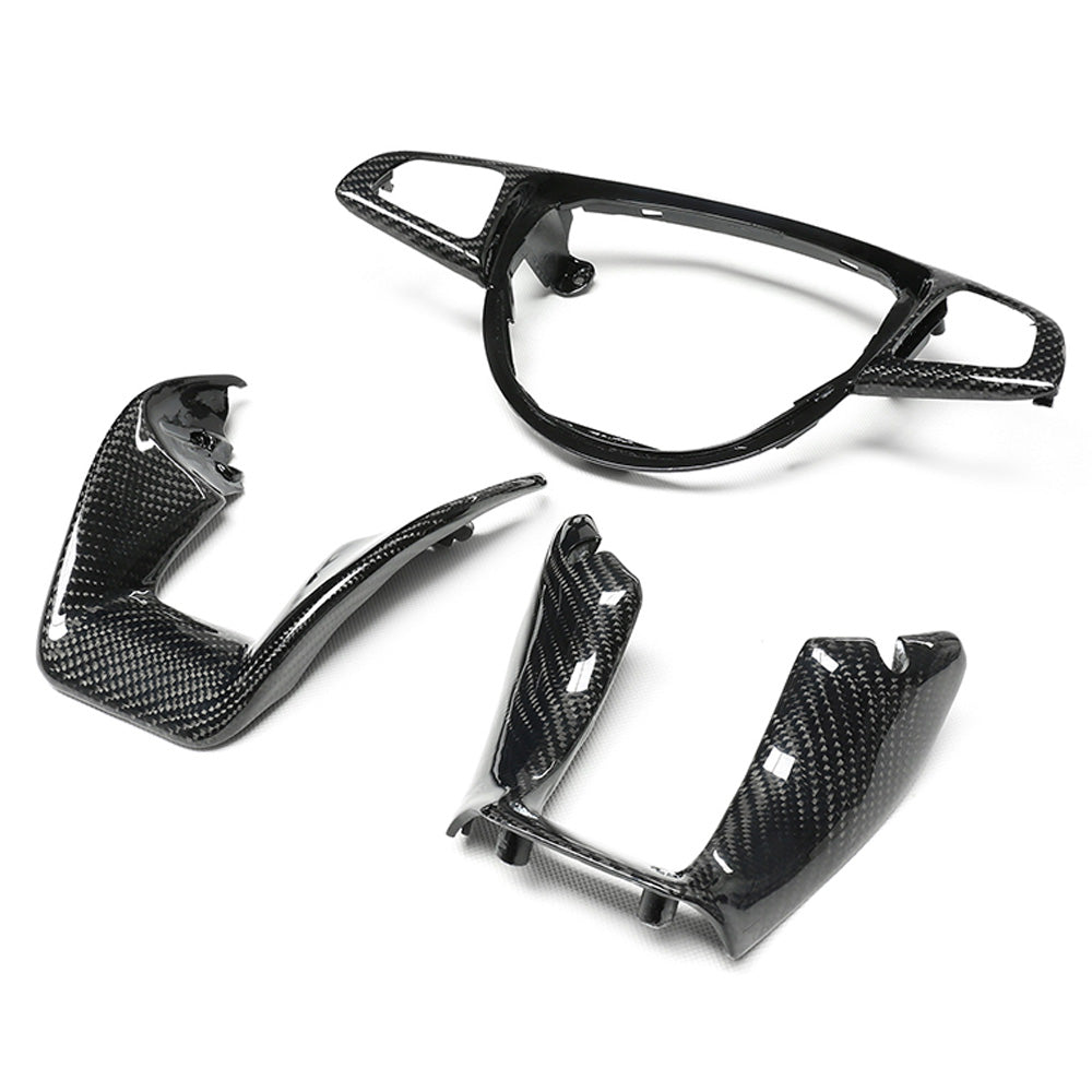 Mercedes AMG carbon fiber steering wheel trim accessory by CT Carbon, featuring a sleek carbon fiber finish on the steering wheel.