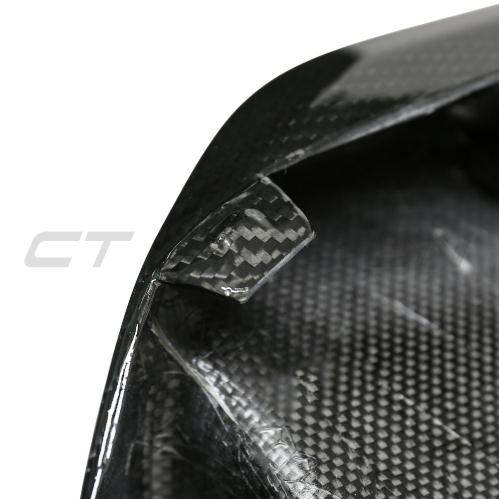 BMW G87 M2 carbon fibre lower grille accessory by CT Carbon, showing sleek black honeycomb design for sporty look.