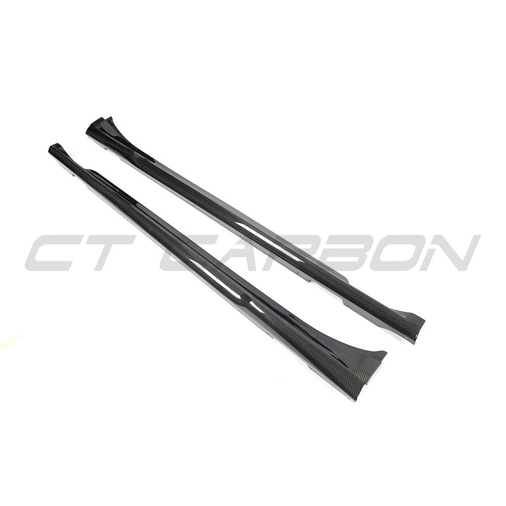 CT Carbon Porsche Taycan 2020-2024 carbon fibre side skirts installed on the vehicle, showcasing sleek aerodynamic design.