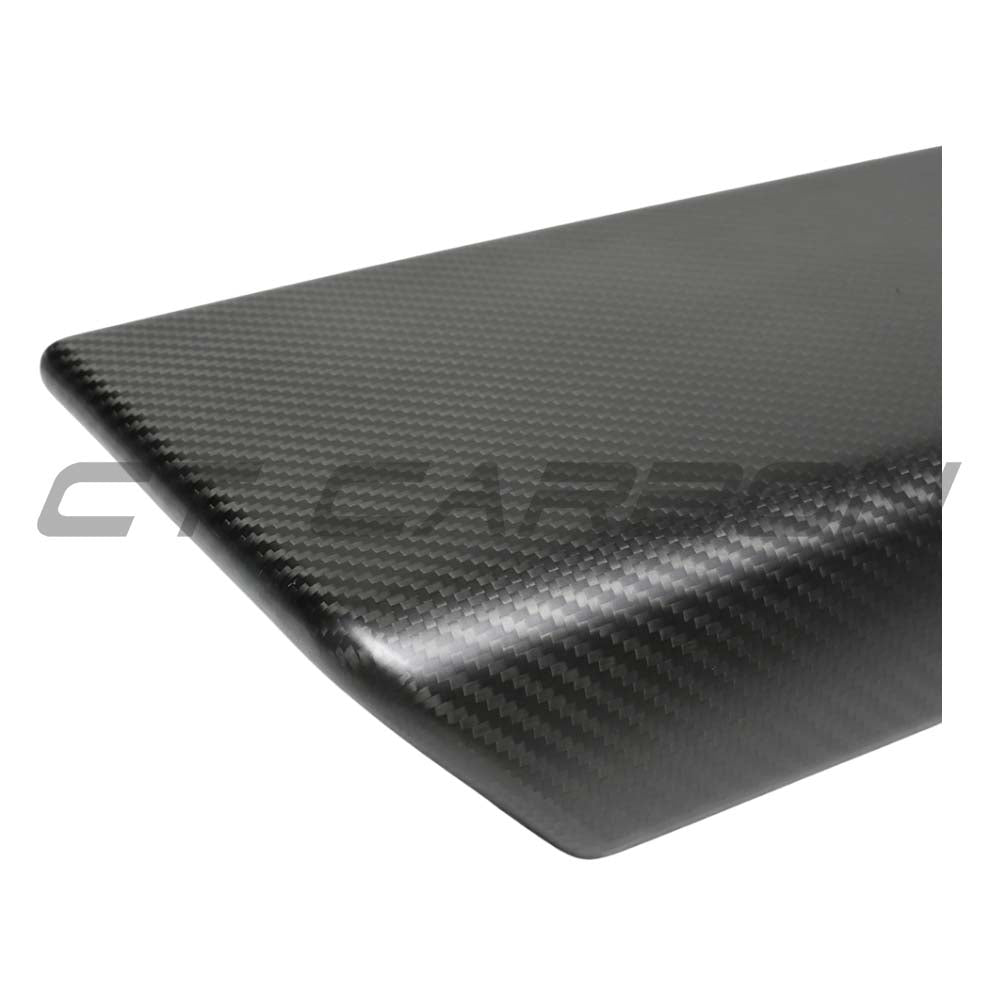 CT Carbon Tesla Model Y 2025+ facelift matte dry carbon armrest cover installed in car interior.