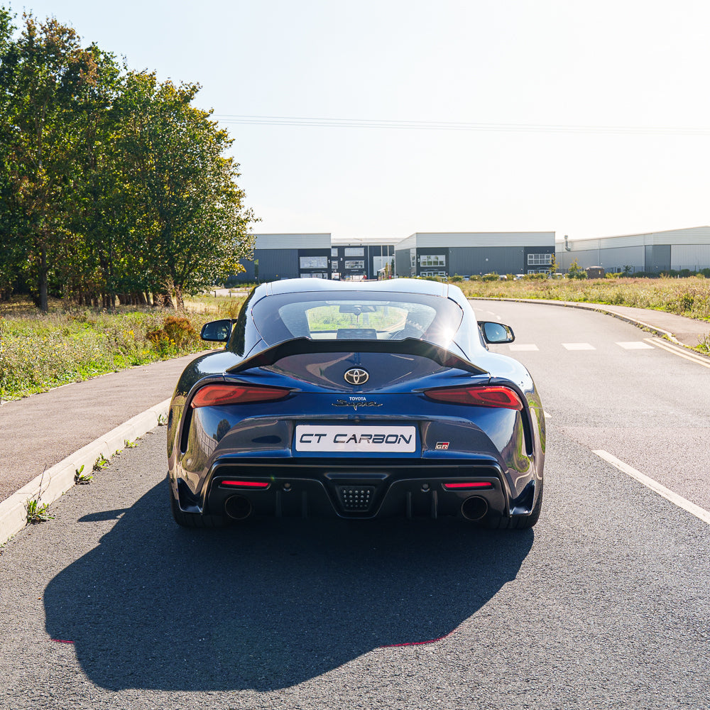 Toyota Supra 2019+ A90 carbon fiber spoiler by CT Carbon, shown installed on the sporty coupe with sleek finish.