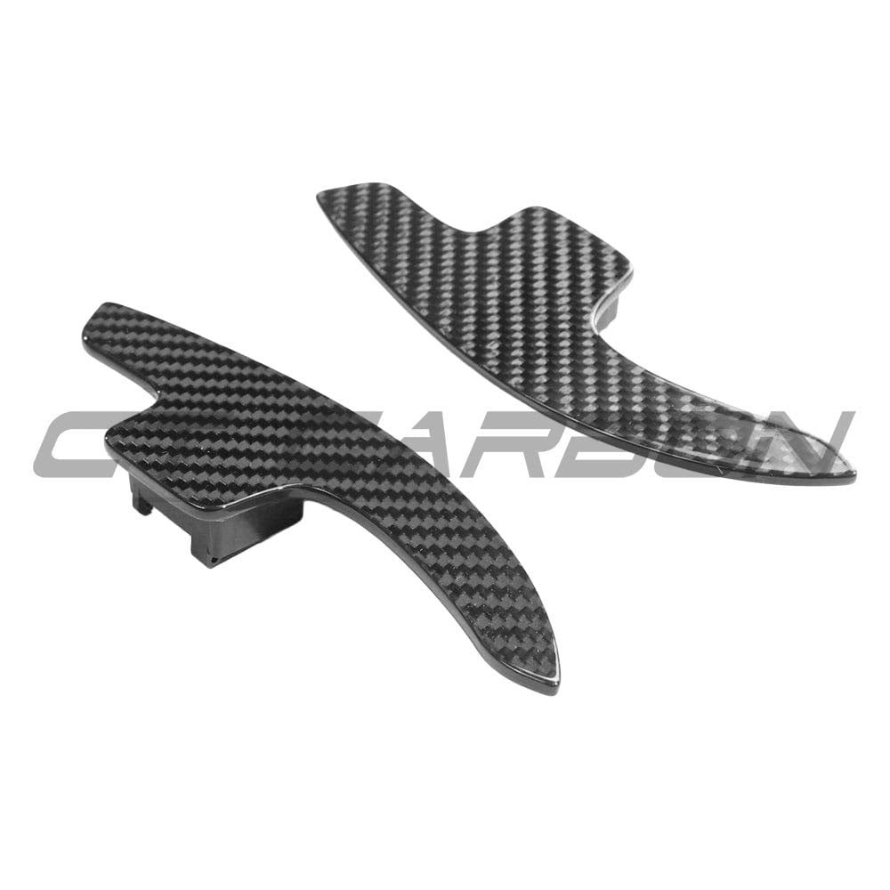 Carbon fiber shift paddles for Audi A3, S3, RS3 8V models by CT Carbon, shown attached to vehicle steering wheel.