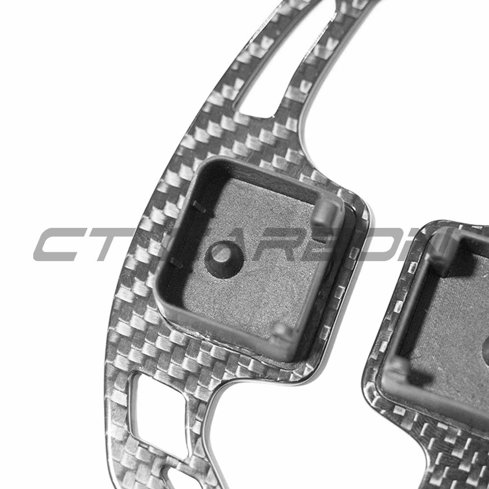 Carbon fibre shifter paddles for Audi A3, S3, RS3 8Y, RS6 C8 by CT Carbon, with sleek design and textured finish.