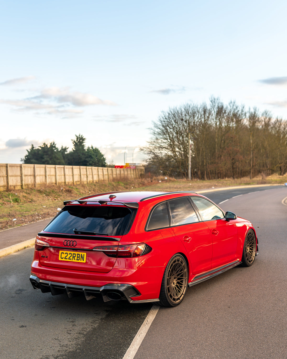 Carbon fiber diffuser for Audi RS4 B9 and B9.5 by CT Design, showcasing sleek, textured carbon fiber surface on the rear of the car.