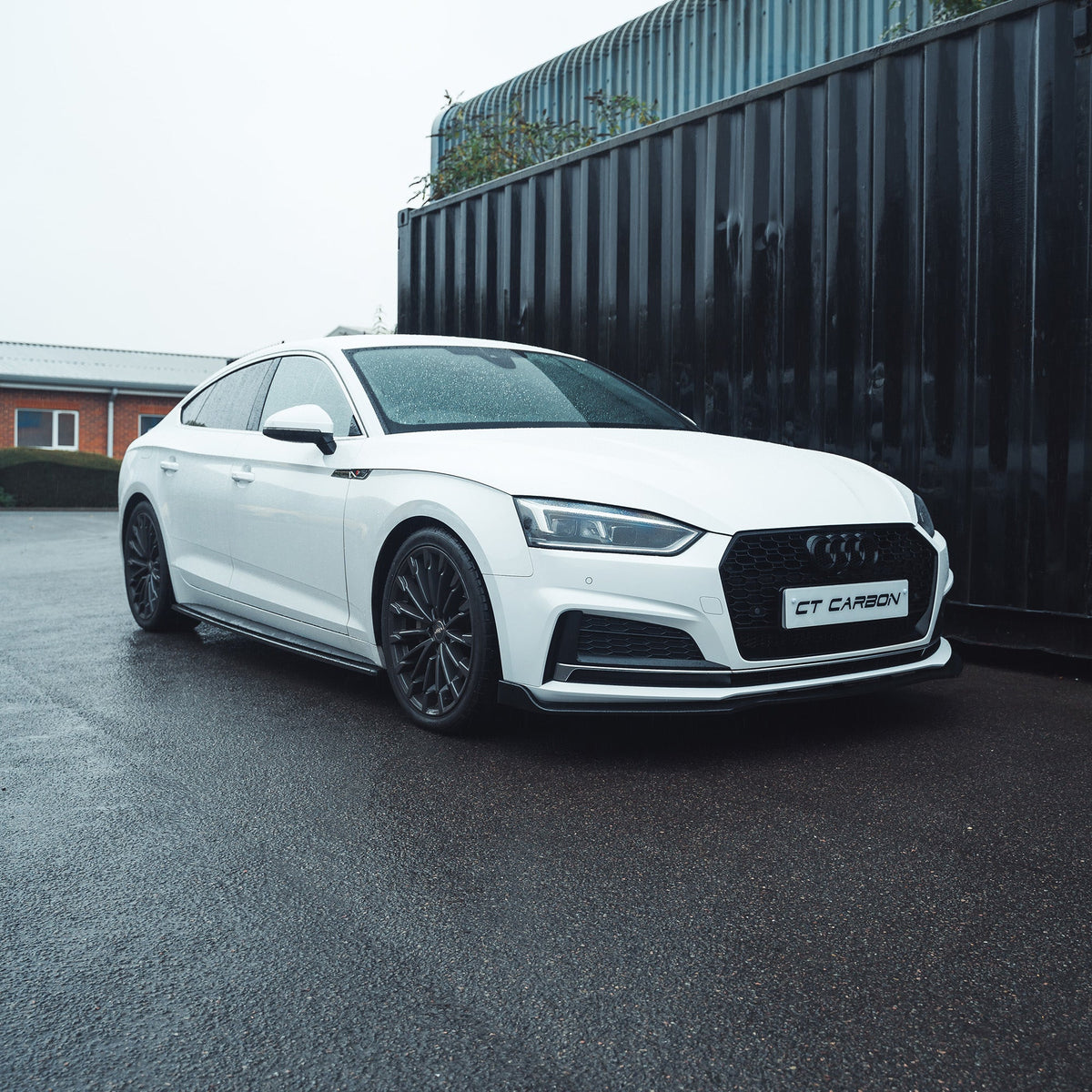 Gloss black splitter for Audi A5/S5 B9 (2016-2019) by CT Carbon, showing the aerodynamic front splitter with a sleek finish.