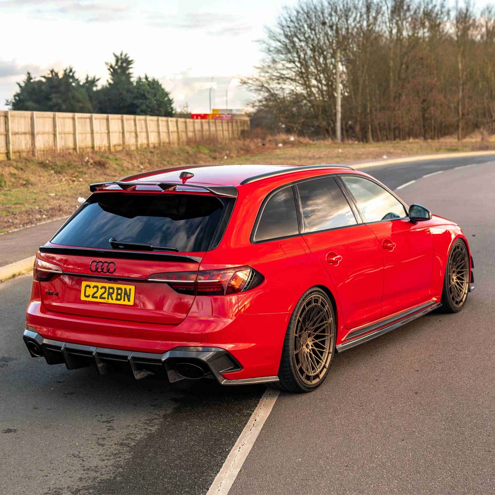 Carbon fiber middle spoiler for Audi A4/S4/RS4 B9 and 9.5 models by CT Carbon, shown installed on vehicle with sleek finish.