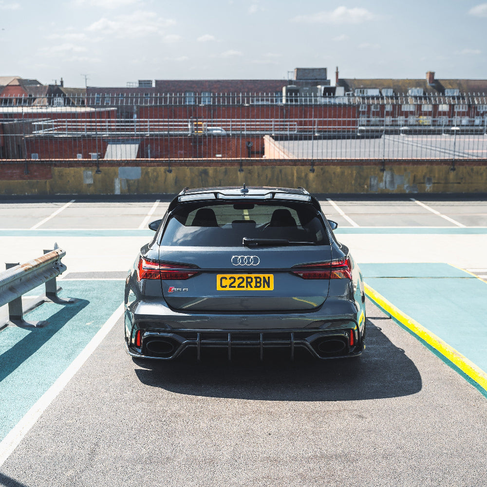 Audi RS6/RS7 C8 carbon fibre diffuser by CT Carbon, showcasing sleek black carbon fiber surface and aerodynamic design.